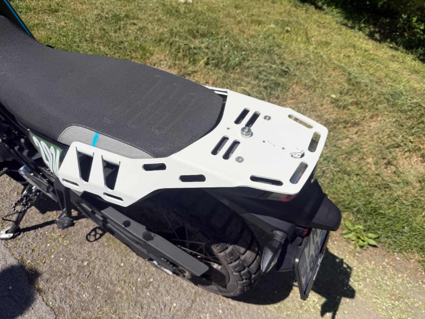 CF Moto 800MT-X rack — real world detail shot, muddy conditions